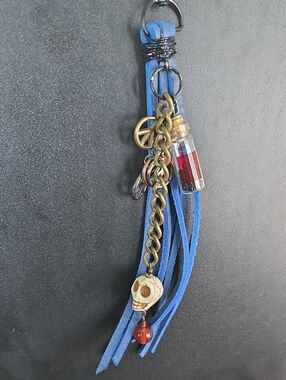 Blue Tassel Keychain with Skull and Charm Accents